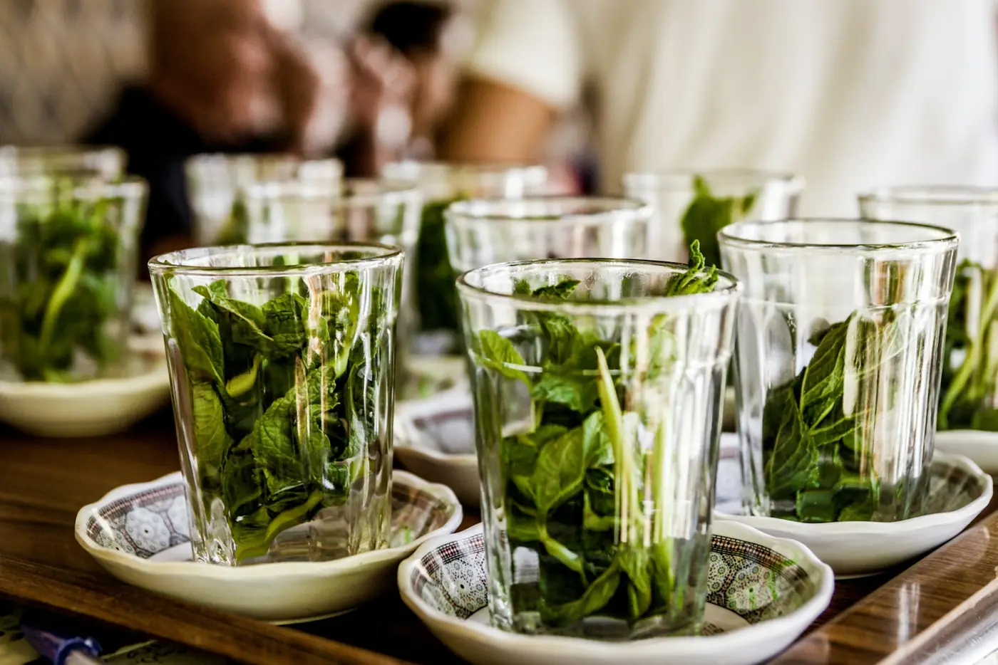 Glasses packed with fresh mint leaves, ready for tea